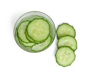Glass of freshness water with cucumber slices, isolated on a white background
