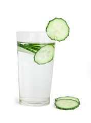 Glass of freshness water with cucumber slices, isolated on a white background