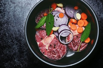 Fresh Ossobuco Meat with vegetablesin the multicooker. Cooking time