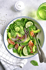 Vegetable salad with salted salmon in vintage bowl .Top view.