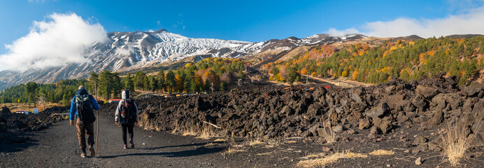 Panoramic view of northern side of Mount Etna, Sicily, with hikers walking on a lavic path