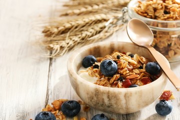 Granola Yogurt Breakfast Bowl with berries / Health wellness concept, selective focus