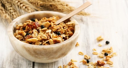 Homemade Granola / Healthy New year concept on white wooden frame, selective focus