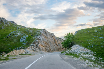 A winding asphalt road is located near Zabljak in the north of Montenegro.