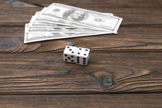 American dollars and bones on the background of a wooden table
