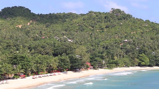 KOH PHANGAN,THAILAND - NOVEMBER 21, 2015: Thong Nai Pan Noi beach and sea water waves. Koh Phangan Island is one of the most popular destinations for tourists