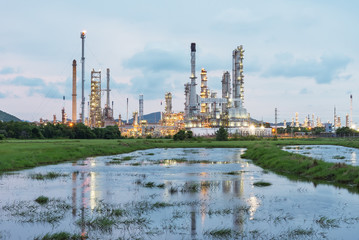 Landscape of oil refinery industry with oil storage tank.