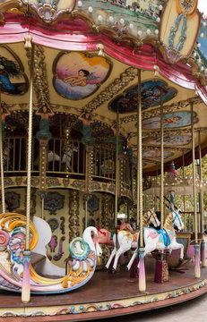 Le Carrousel Paul Cezanne in Aix en Provence France with colorful horses, murals and mermaids.