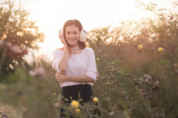 Portrati of beautiful asian model  outdoors in a forest. Pretty Thai girl in garden. Free from copy space.