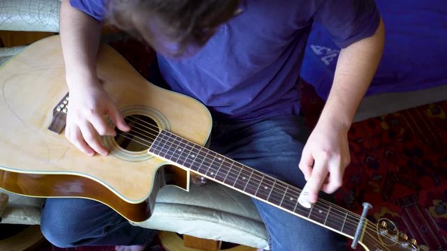 Looking straight down on a beater slide guitar with pvc sider.