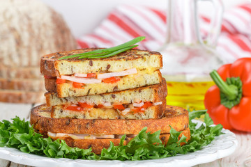 Sandwich with ham, cheese and Bulgarian pepper white bread with flax seeds. Breakfast. Selective focus