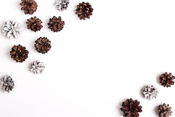 Pine cones with copy space on white background. Flat lay.