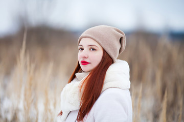 Cute girl outdoors on a sunny winter day.