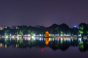 
Night view of Turtle Tower or Tortoise tower which is located in the middle of the Hoan Kiem Lake. Hoan Kiem Lake meaning "Lake of the Returned Sword". 
