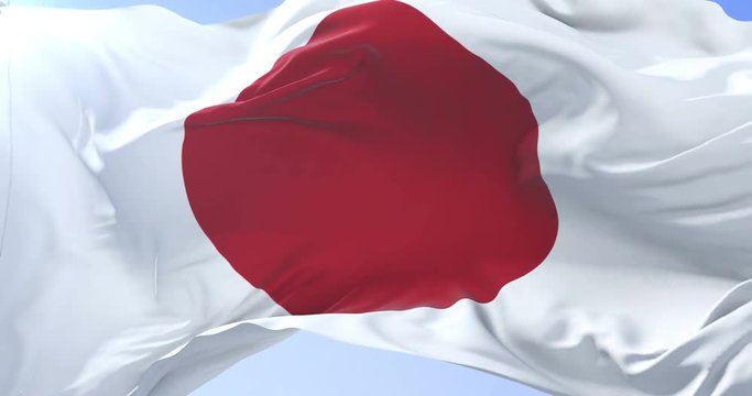 Japanese flag waving at wind in slow in blue sky, loop