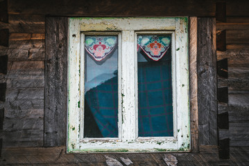 Old window of a traditional Romanian wooden house