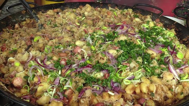 Slovak national specialty original halusky with brynza and cabbage, very healthy, tasty and nutritious for man, sale of Christmas markets in Olomouc