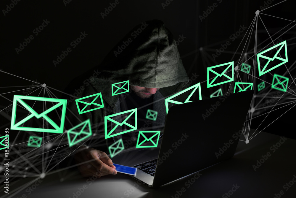 Poster hacker man in the dark using computer to hack data and information system