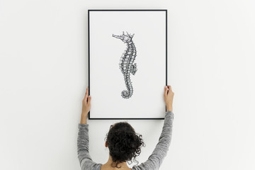 Picture frame mockup with a seahorse drawing © Rawpixel.com