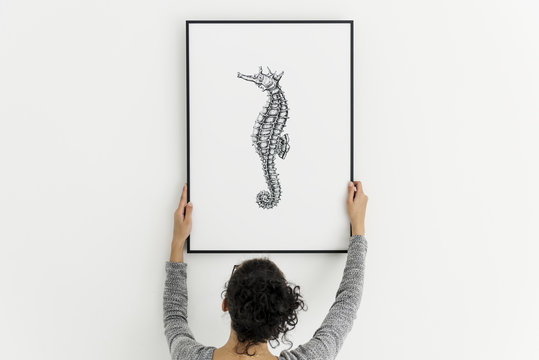 Picture frame mockup with a seahorse drawing