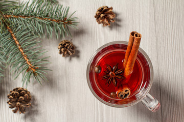 Glass of Christmas mulled wine with cinnamon, star anise and cloves