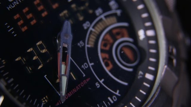 Macro close up of a tactical digital watch face functioning

