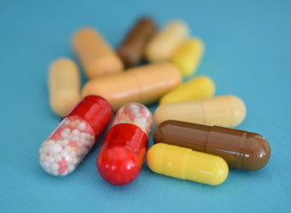  tablets capsules in a group of multicolored 