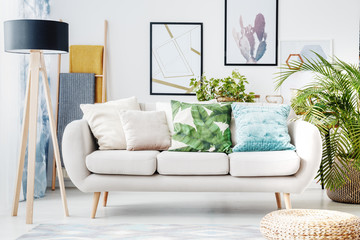 Floral cushion on beige sofa