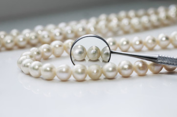dazzling pearls and are reflected in a dental mirror