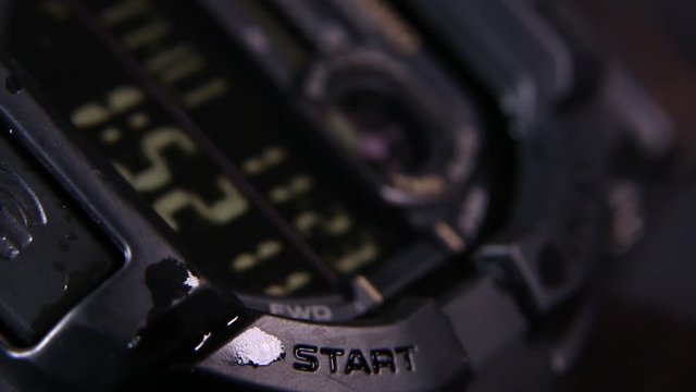 Macro close up of a tactical digital watch face functioning
