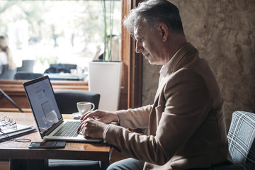 Businessman Typing on Laptop