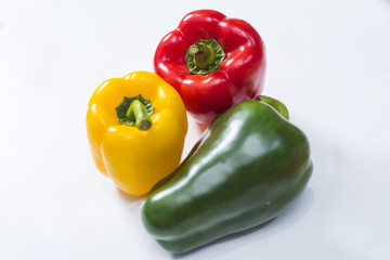 three bell peppers isolated on white background