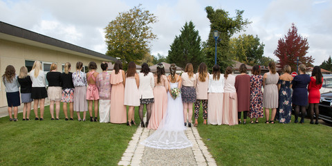 a back view of girls in wedding group