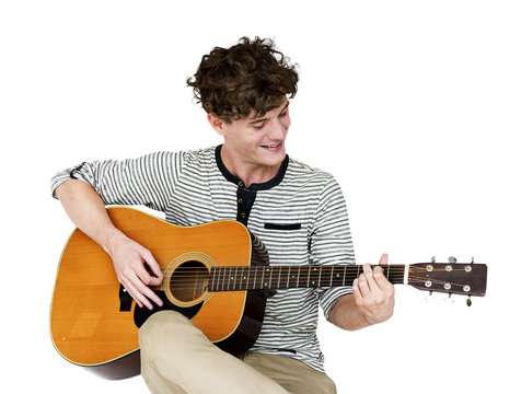 Man guitarist player sitting and playing guitar