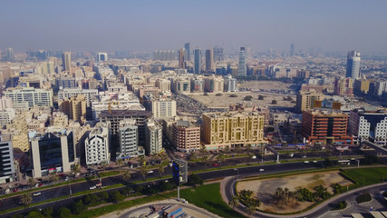 Fototapeta na wymiar Beautiful panoramic scene of Dubai city in UAE. View from above. Top view of Dubai, beautiful homes, transport interchange, the traffic