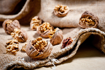 Fototapeta na wymiar Large and small, whole and chopped walnuts