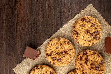 Chocolate chips cookies on baking paper with copyspace
