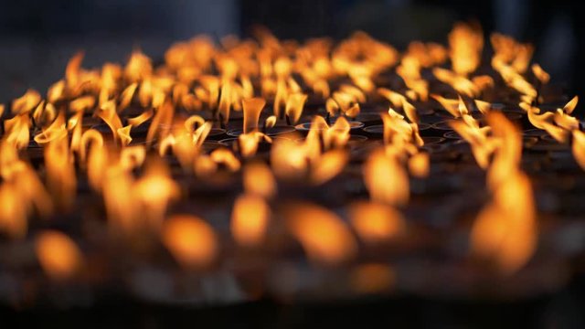 Candles for prayers at Buddhist site of Boudhanath. Kathmandu, Nepal. 4K, UHD