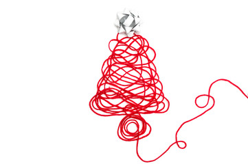 A tree made of red thread and ribbon on white background