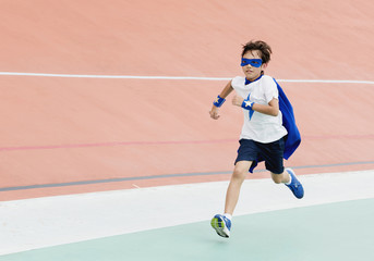 Obraz premium A boy playing superhero