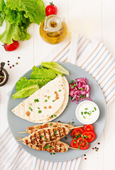 Minced Lula kebab grilled turkey (chicken) with fresh vegetables. Top view