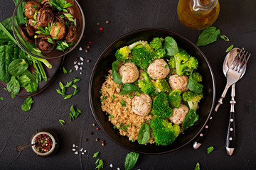 Baked meatballs of chicken fillet with garnish with quinoa and boiled broccoli. Proper nutrition. Sports nutrition. Dietary menu. Top view