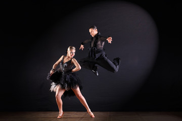 dancers in ballroom isolated on black background