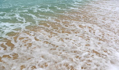 Landscape view of sea wave on the beach sand.