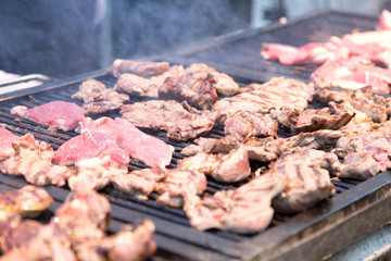Grilled meat  on the flaming grill.
