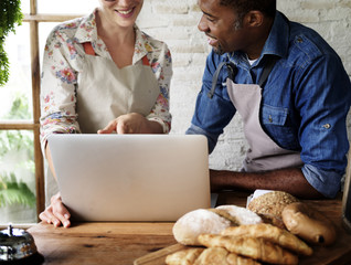 Pastry shop partnership talking in the store together