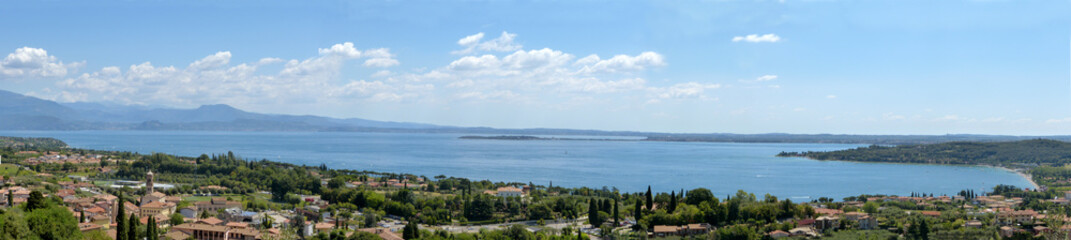 Fototapeta na wymiar Panoramic view of Lower Lake Garda with the background of the peninsula of Sirmione - Italy