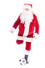 Portrait of Santa Claus playing soccer ball on white background