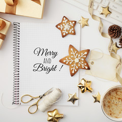 christmas workspace with notebook keyboard, sketchbook, christmas gifts and ornaments