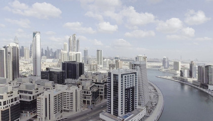 DUBAI - DECEMBER 2016: Aerial view of city skyscrapers. Dubai attracts 20 million tourists annually